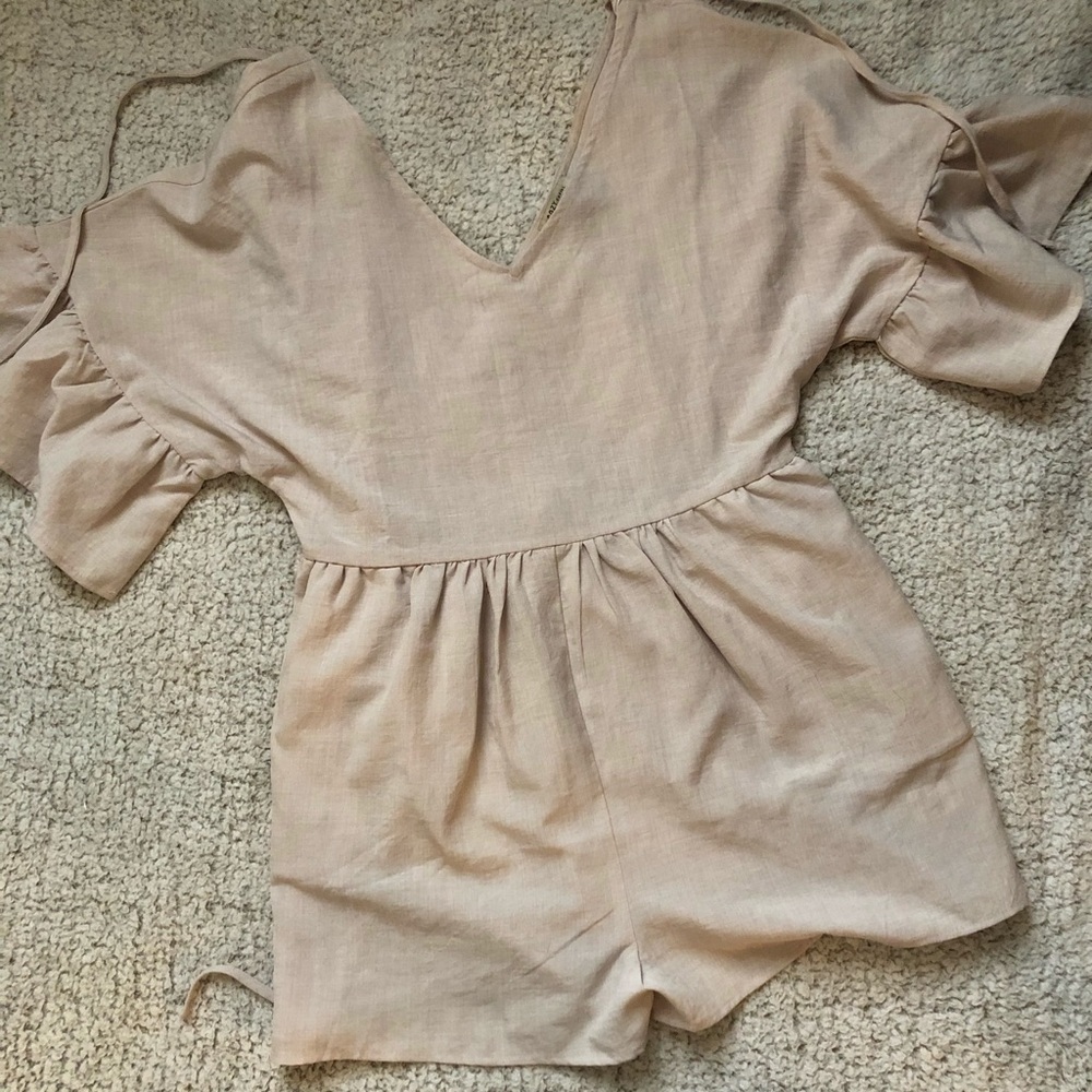 Cream romper never been worn
